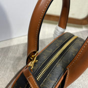 TOP HANDLE BAG 20 IN BLACK TRIOMPHE CANVAS AND BROWN CALFSKIN