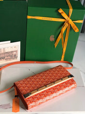 MONTE-CARLO PM CLUTCH 25 IN ORANGE GOYARDINE CANVAS