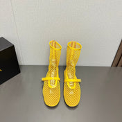 ALAIA SHORT BOOTS IN LEMON YELLOW MESH FISHNET