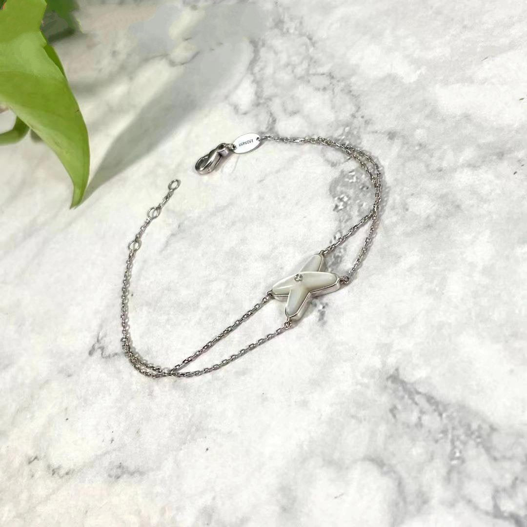 chaumet-jeux-de-liens-bracelet-white-gold-mother-of-pearl-diamond-083163-2_a420a561-52f6-45ab-98bd-b97fd340f4f6.jpg