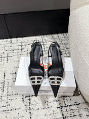 POINTED HIGH SLINGBACK IN BLACK PATENT CALFSKIN WITH CRYSTAL BUCKLE