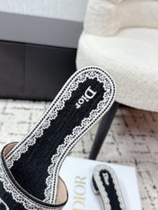DIOR 26S HIGH HEEL SLIDES IN BLACK AND WHITE EMBOSSED OBLIQUE LACE EMBROIDERY