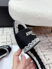 DIOR 26S HIGH HEEL SLIDES IN BLACK AND WHITE EMBOSSED OBLIQUE LACE EMBROIDERY
