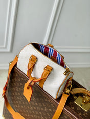 KEEPALL BANDOULIÈRE 25 IN WHITE MONOGRAM HERITAGE CANVAS BRWON CALFSKIN
