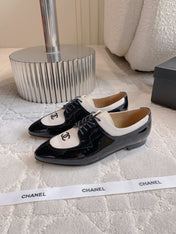 CHANEL 25S TWO TONE LACE UP IN BLACK AND WHITE SHINY CALFSKIN