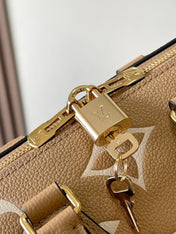 SPEEDY BANDOULIÈRE 20 IN MILK TEA MONOGRAM EMPREINTE LEATHER