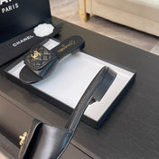 FLAT MULE IN BLACK LAMBSKIN