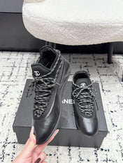 CHANEL 26S LACE-UP SNEAKERS IN BLACK FABRIC AND LAMBSKIN