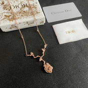 CD 26S CRYSTAL ROSE BRANCH PENDANT NECKLACE IN ROSE GOLD TONE METAL 631896
