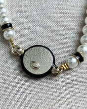 Classic CC bracelet with faux pearls and black resin.