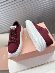 MIUMIU 26S PLATFORM SNEAKERS IN DARK RED CANVAS