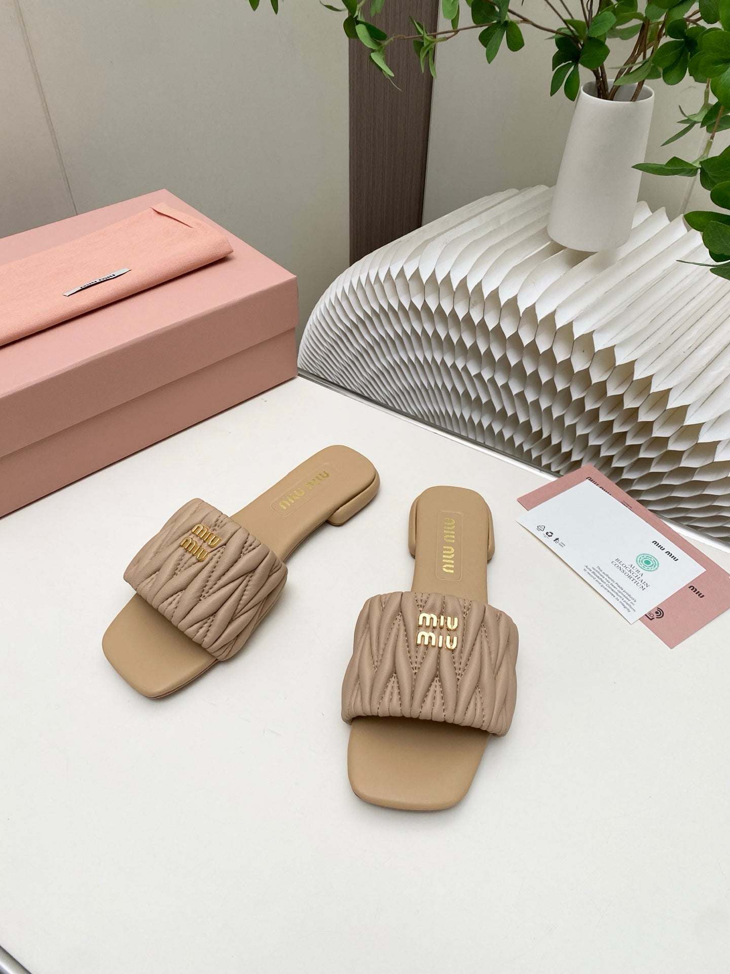 MIUMIU 26S MATELASSE SLIDES IN BEIGE CALFSKIN