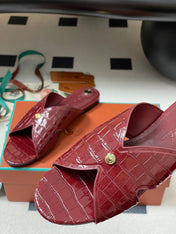FLAT SLIPPERS IN RED CALFSKIN SNAKE EMBOSSING