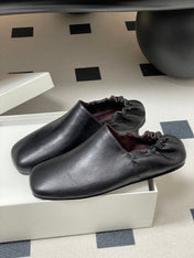 CELINE 26S ELASTIC-BACK FLAT SHOES IN BLACK LAMBSKIN