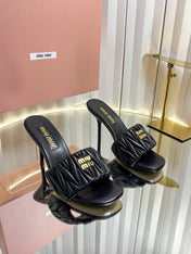 MIUMIU 26S HIGH-HEEL MULE SANDALS 85MM IN BLACK CALFSKIN GOLD HARDWARE