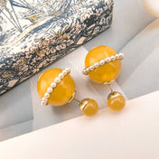 CD 26S YELLOW RESIN PEARL DOUBLE BALL EARRINGS IN GOLD METAL 631070
