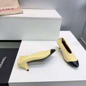 CHANEL 26S COLOR-BLOCK HIGH HEELS 45 MM IN YELLOW AND BLACK LAMBSKIN