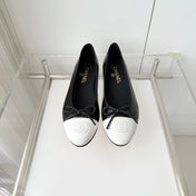CHANEL 26S BALLET FLATS IN BLACK CRACKED CALFSKIN WITH WHITE TOE CAP AND BOW