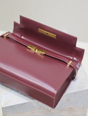 MANHATTAN MEDIUM 29 IN WINE RED SMOOTH CALFSKIN GOLD BUCKLE
